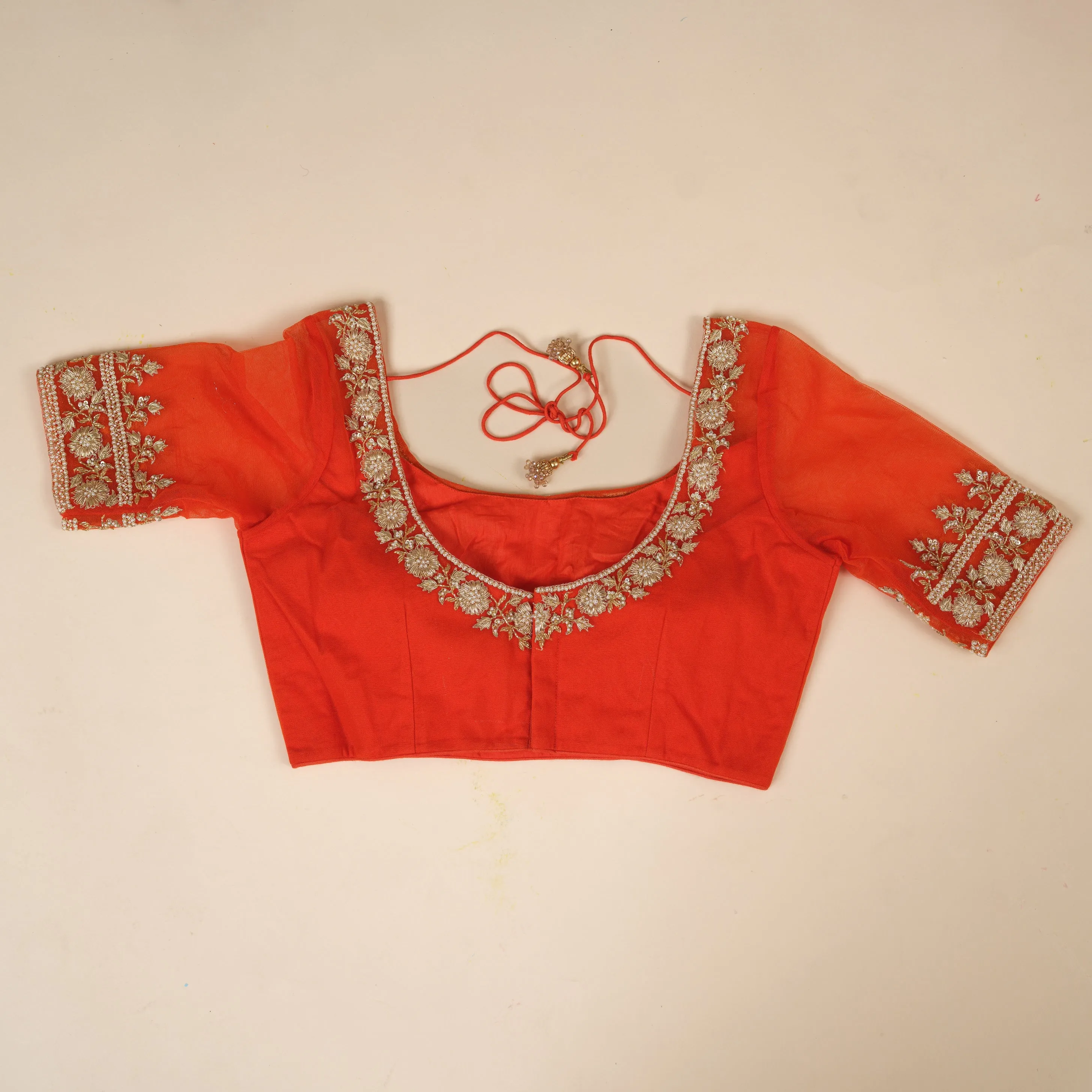 Bright orange stitched blouse