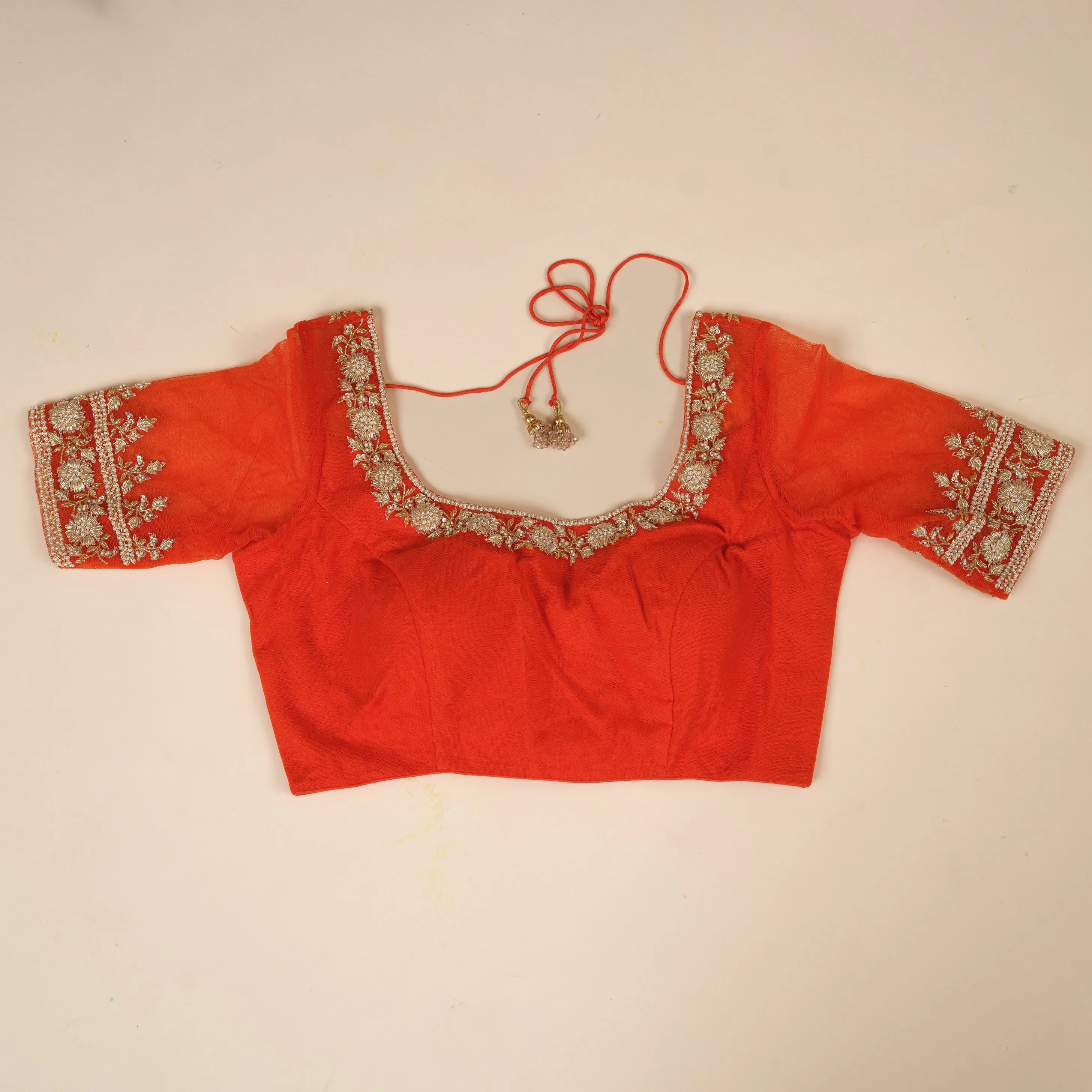 Bright orange stitched blouse